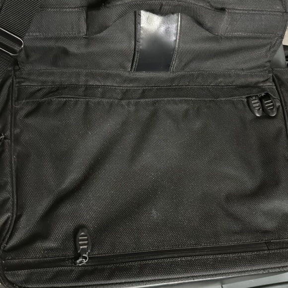 Used Tumi fabric computer bag. The handle has been worn. all the zippers work. - Picture 4 of 5